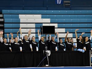 The North Carolina gymnastics teams waves to the crowd during its Equality Meet on Jan. 19 in Carmichael Arena.