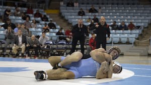 Graduate student Clay Lautt wrestles Ohio State senior Ethan Smith at Carmichael Arena on Sunday, Nov. 20, 2022. UNC lost to Ohio State 9-33.