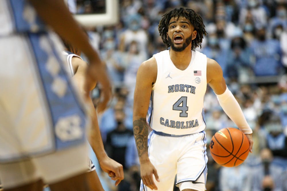 UNC sophomore guard RJ Davis (4) looks for an open pass during a UNC men's basketball game against Duke in the Dean Smith Center on Saturday, Feb. 5, 2022. Duke won 87-67.