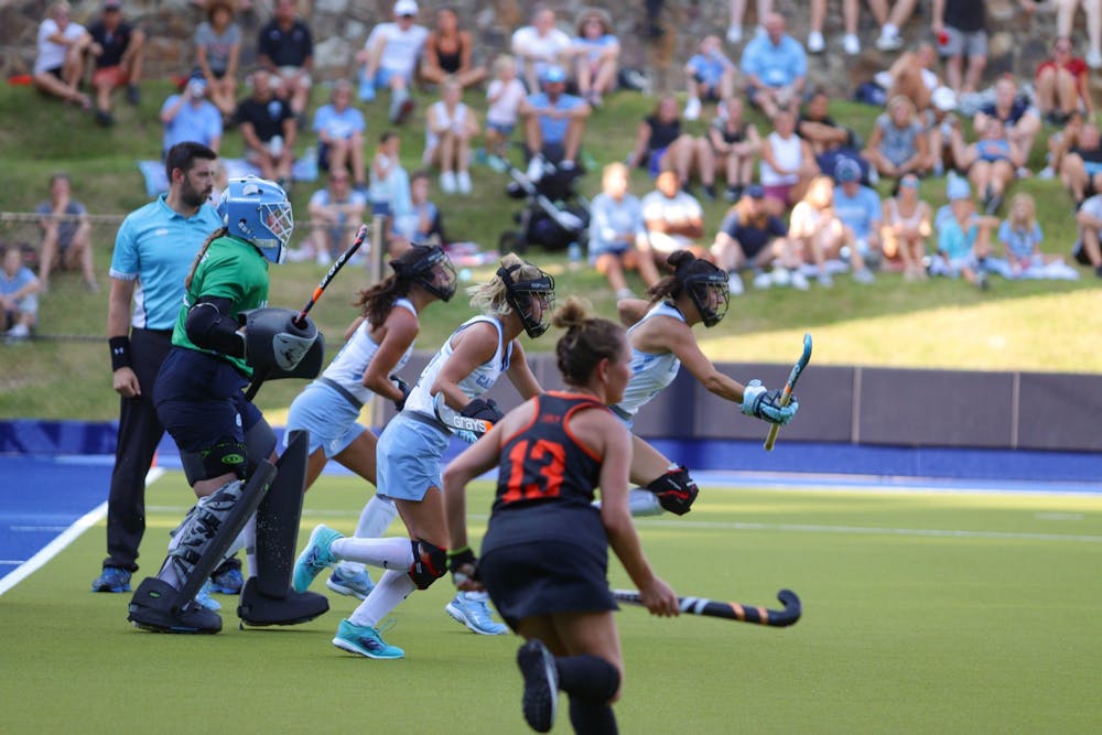 The UNC Field Hockey penalty defenders sprint towards Princeton offense as they go for a penalty corner shot. UNC beat Princeton 4-3 on Friday, Sept. 2, 2022.