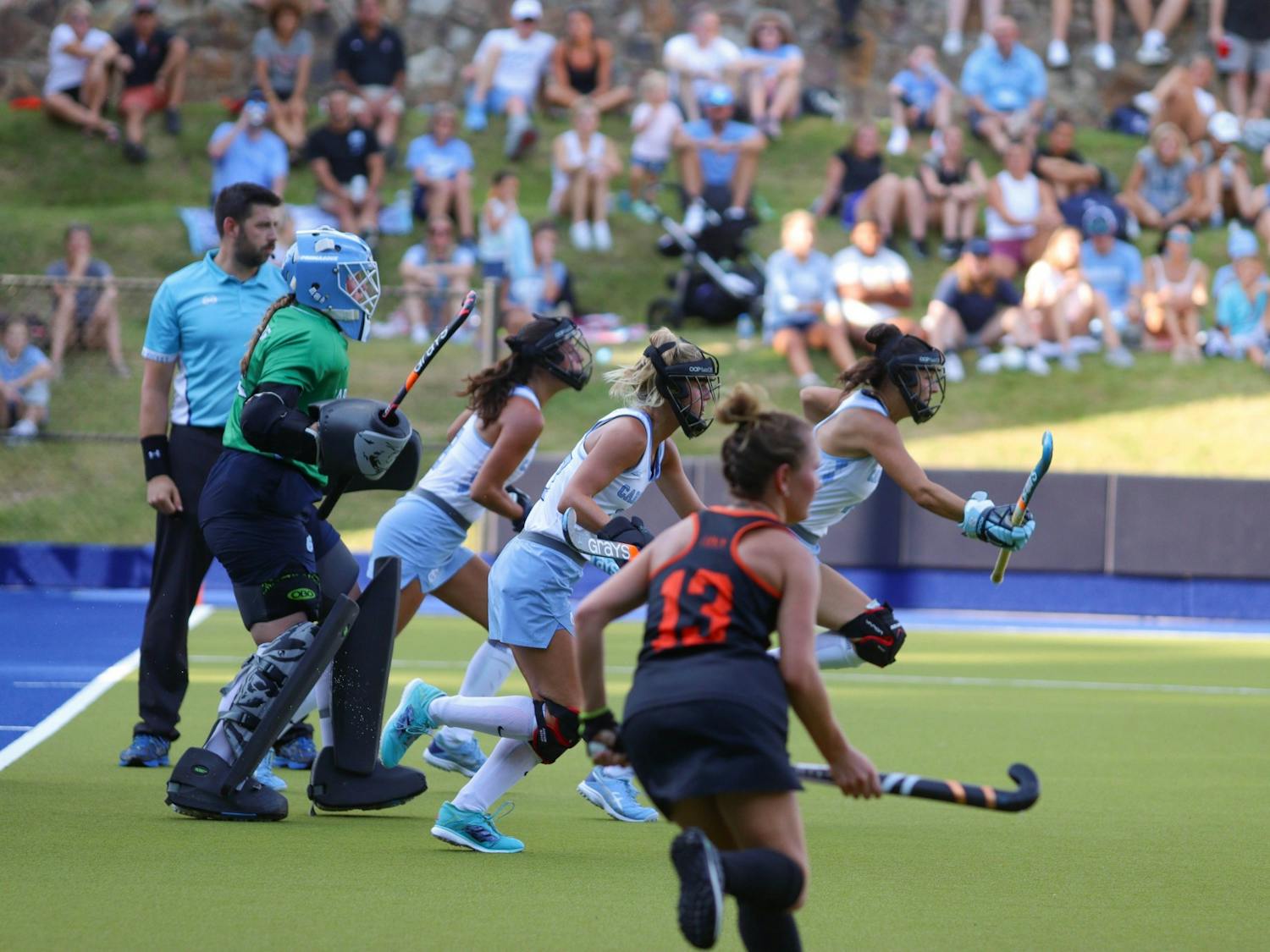 The UNC Field Hockey penalty defenders sprint towards Princeton offense as they go for a penalty corner shot. UNC beat Princeton 4-3 on Friday, Sept. 2, 2022.