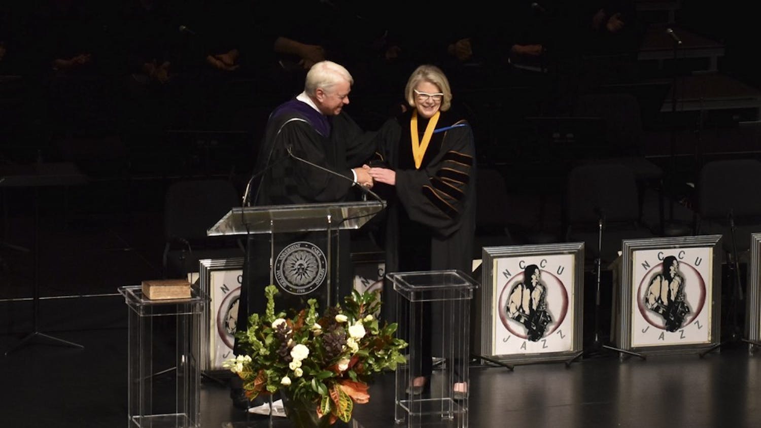 Chair Bissette congratulates President Margaret Spellings at her inauguration on Thursday at Memorial Hall.&nbsp;