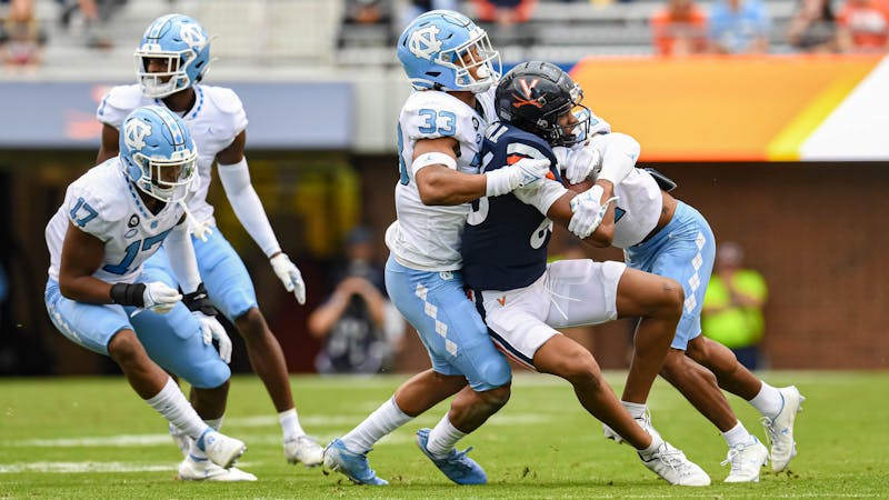 Cedric Gray leads battered UNC defense in victory against Virginia