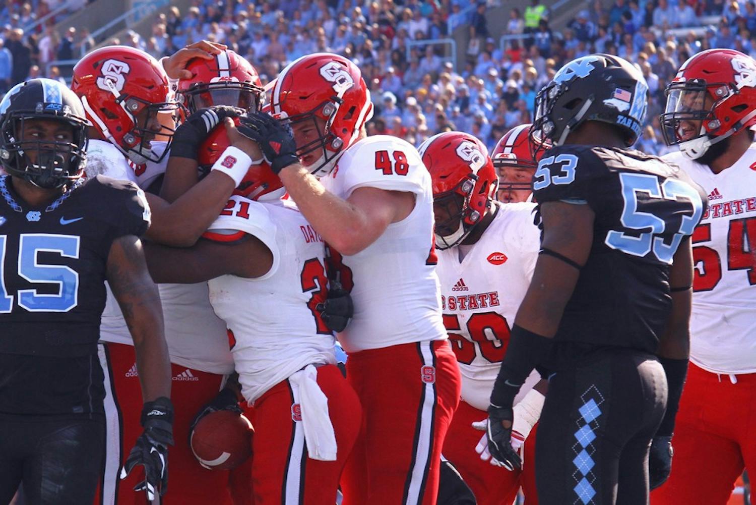 N.C. State players celebrate after a touchdown.&nbsp;