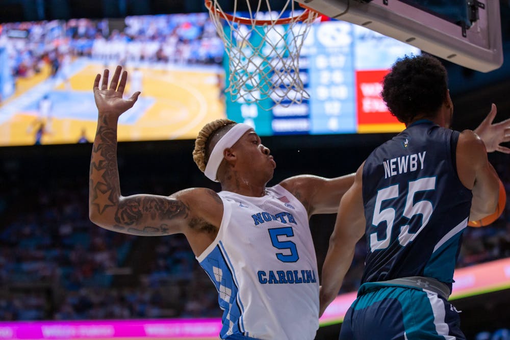 UNC senior forward, Armando Bacot (5), attempts to rebound the ball at the game against UNCW in the Dean Smith Center on Nov. 7, 2022.