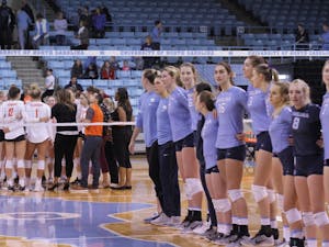 The UNC volleyball team sings the alma mater after its 3-0 win against Clemson on Saturday afternoon in Carmichael Arena.