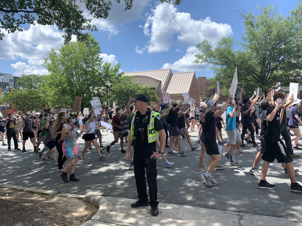 A Chapel Hill Police Officer stands guard at the Chapel Hill protest hosted by Black Congress on Friday, June 15, 2020.