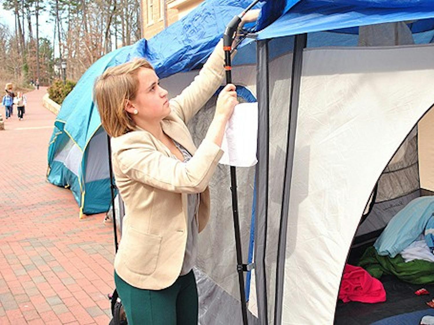 Tents popped up over night to wait in line for the Morrison super suites outside the SASB buildings on South campus. Gabriela Wilberding, a first-year, along with her future suitemates threw up a tent late after the game late last night in order to try and secure a position for one of the limited super suites. They planned to camp out for the full 12 days in order to get the rooms and even slept there last night. However, Gabriela says "We received an email this morning around 10:00 o'clock saying that we couldn't camp out for the suites anymore. It would now be done by a lottery system." After this news spread, the tents slowly began to come back down. 