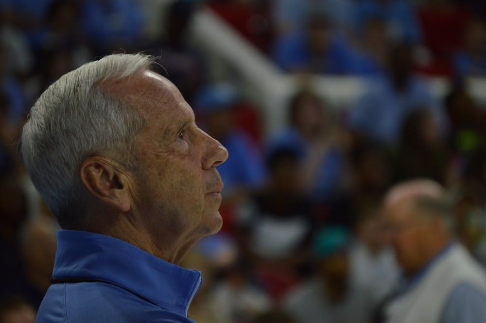 Coach Roy Williams looks at the scoreboard during the North Carolina men's basketball team's practice at PNC Arena in Raleigh on Wednesday.