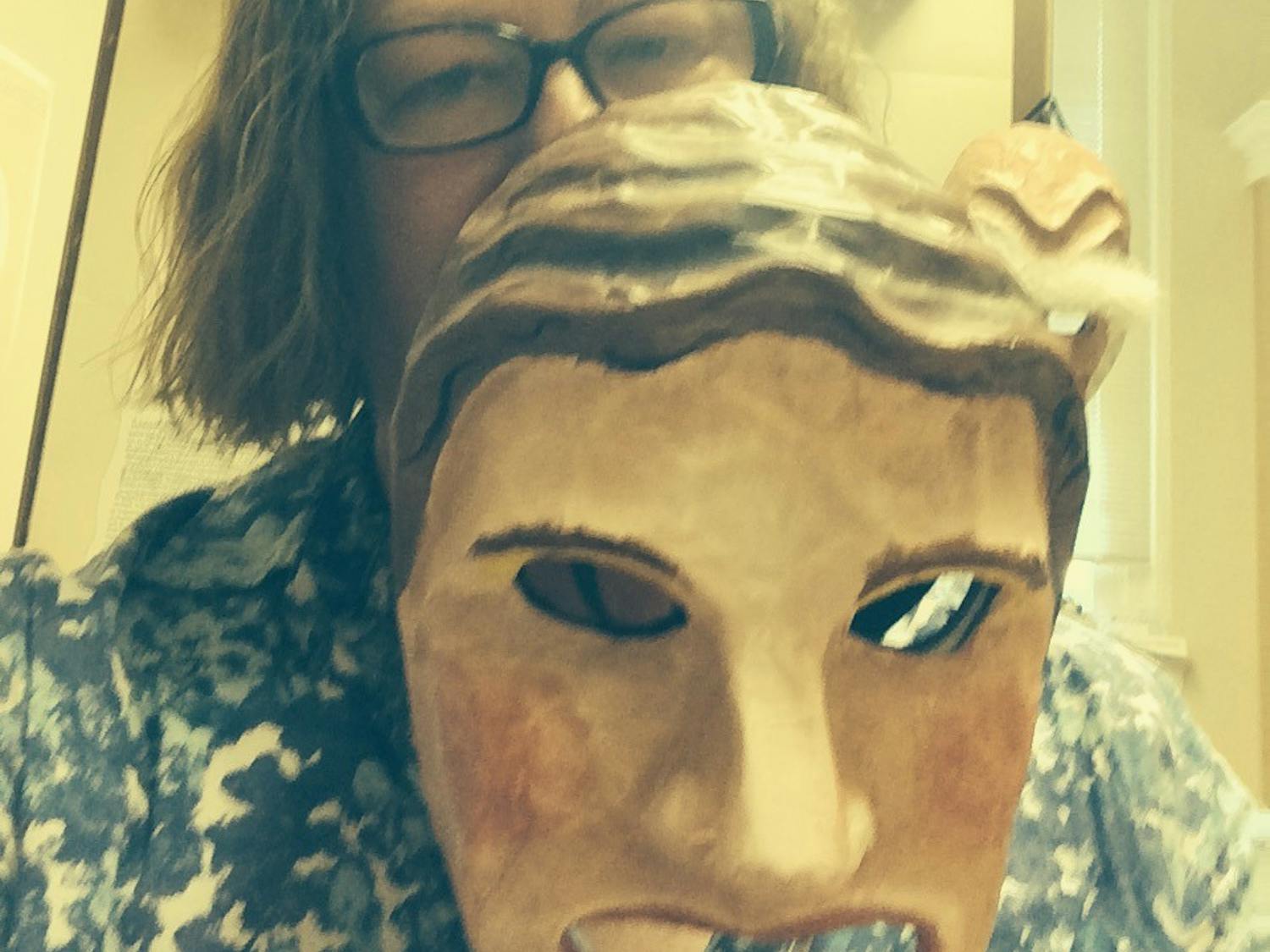 UNC classics Professor Sharon James holds a mask used during their classes. James recently won the Board of Governor's 2021 excellence in teaching award. Photo courtesy of Sharon James.