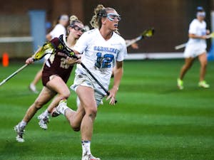 Graduate student midfielder Ally Mastroianni (12) in play during the 2022 ACC championship game against Boston College on May 7, 2022, in Chapel Hill, NC. UNC won that title 16-9.