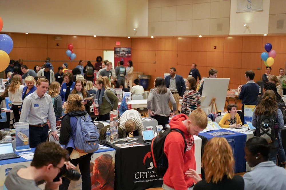 <p>Students visit various booths at the UNC Study Abroad Fair on Jan. 24, 2020 in the Great Hall. UNC Global Guarantee promises to give all students access to a global experience, and hopes that by 2023 a majority of undergraduate students will study abroad.&nbsp;</p>