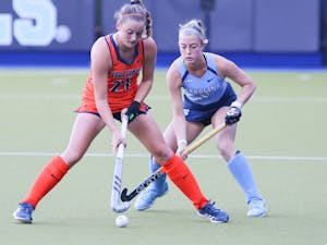 UNC senior back Madison Orobono (5) guards a Virginia player during a 3-1 victory at Karen Shelton Stadium on Oct. 21, 2022.