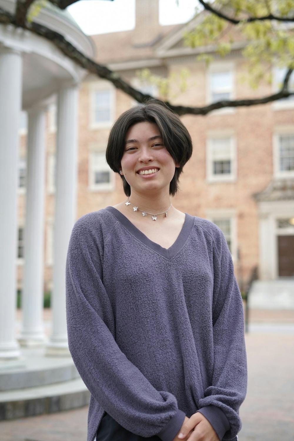 <p>Molly Moran, the Political Chair for the Asian American Student Association, poses for a portrait at the Old Well on Tuesday, April 5, 2022.</p>