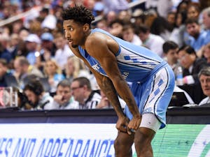 UNC graduate forward Leaky Black (1) drops his hands to his knees during the final moments of the game against Virginia in the ACC Tournament Quarterfinals at Greensboro Coliseum on March 9, 2023. UNC fell to Virginia 68-59.