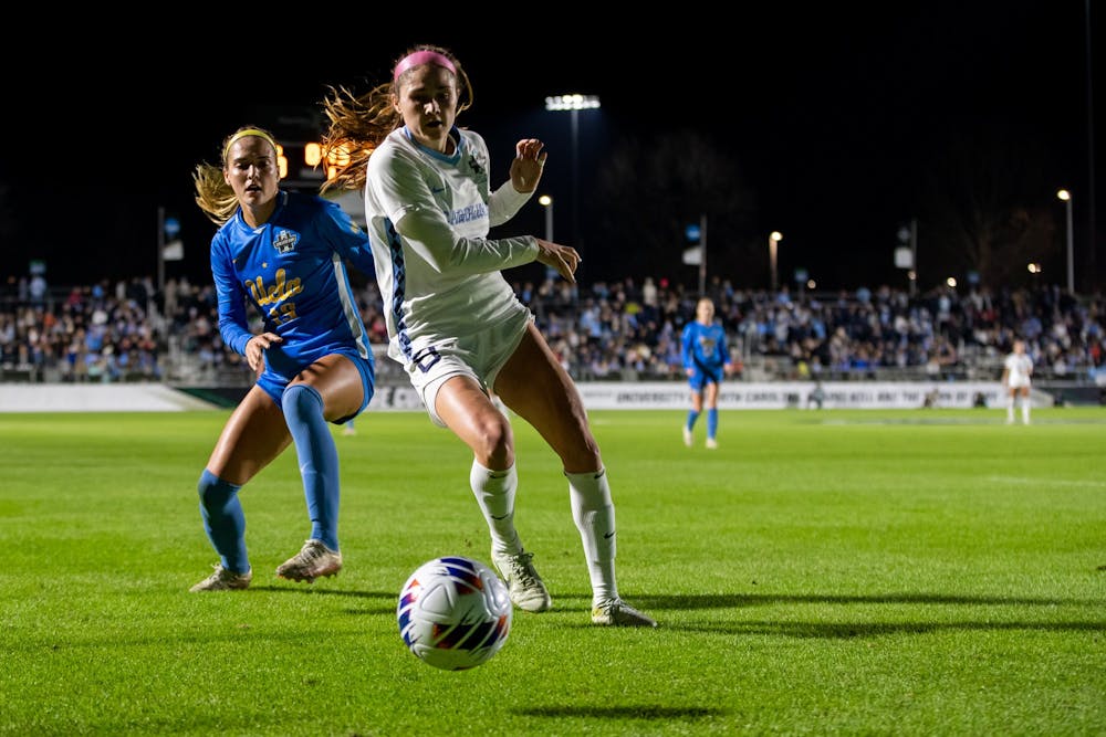 UNC senior forward Emily Moxley (8) falls short of the ball during UNC's game against UCLA in the NCAA Finals at WakeMed Soccer Park on Friday, Dec. 5, 2022. UNC lost 3-2 in 2OT.