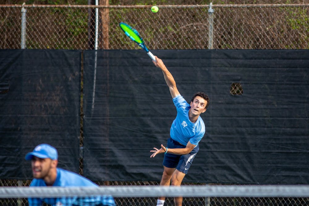 Sophomore Peter Murphy serves the ball during UNC's match against Louisville at the Chapel Hill Tennis Club on March 25th, 2022. UNC won 4-1.