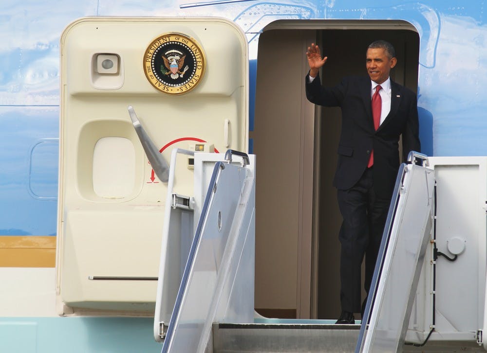 	President Barack Obama exits Air Force One on Wednesday January 15.