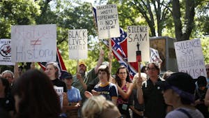 Demonstrators rally around what remains of Silent Sam on Saturday, August 25. 