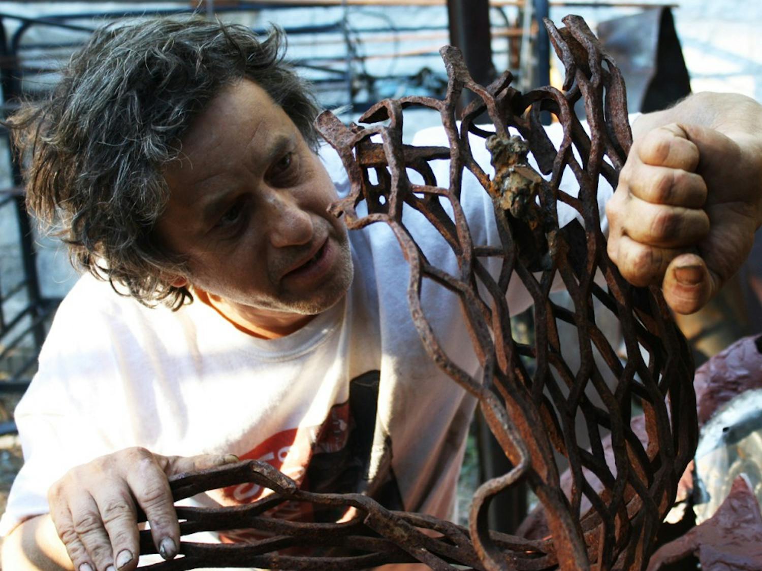 Reuven Fields, a local artist born in Israel, creates and sells a diverse collection of handmade metalworks from his home on N.C. 54.