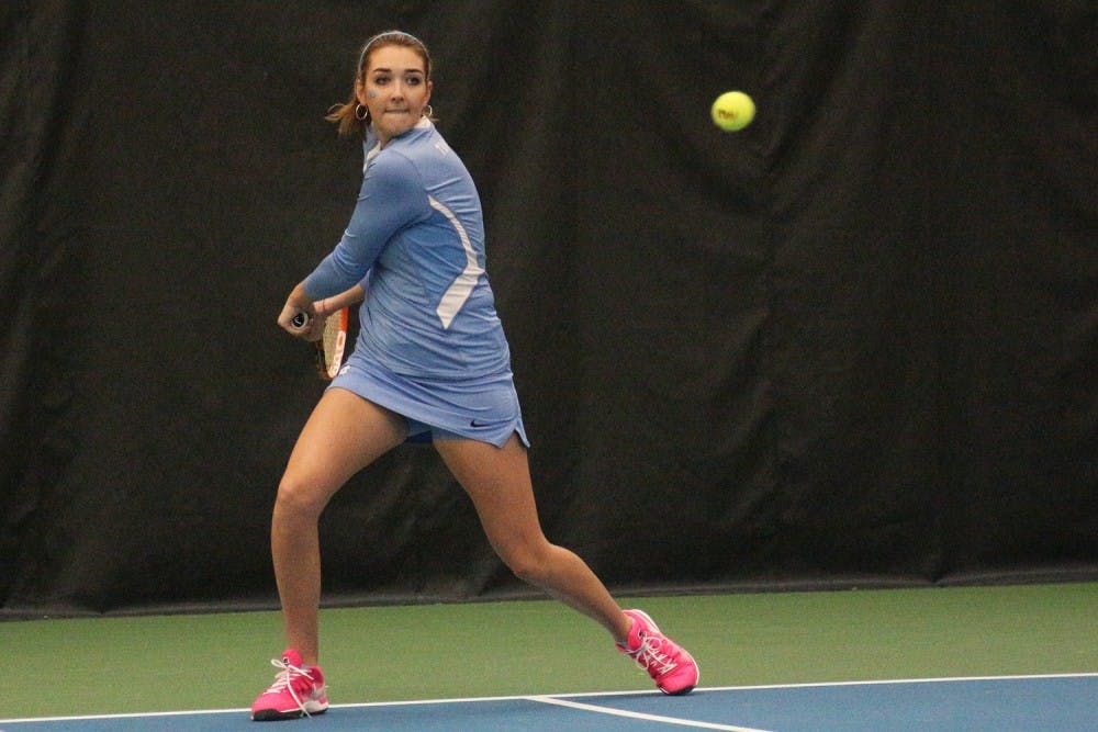 Senior Caroline Price prepares to backhand an Elon return in Friday's match against the Phoenix. 