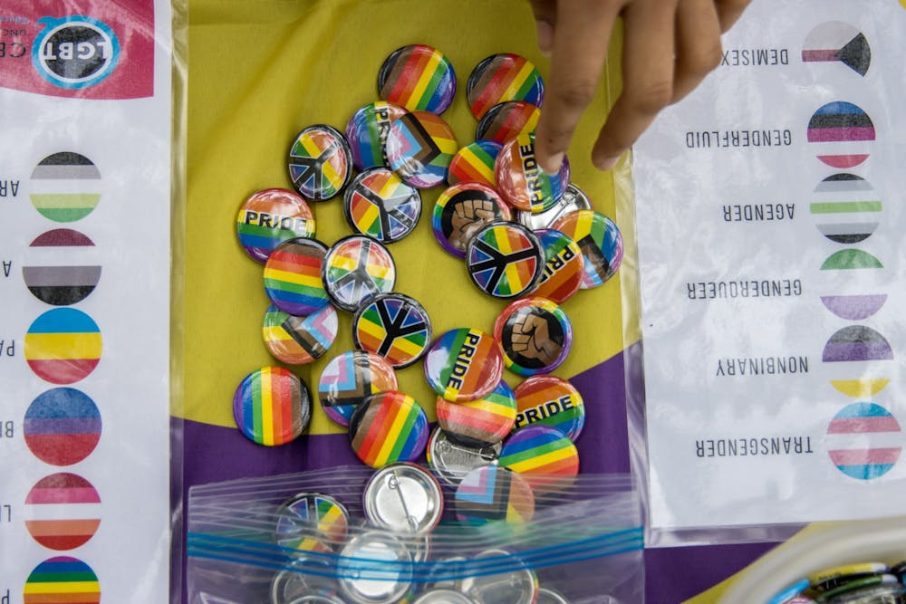 <p>Various pride pins were offered to patrons who visited the coming out day table in the Pit on Oct. 11. The event was sponsored by UNC's LGBTQ Center.&nbsp;</p>