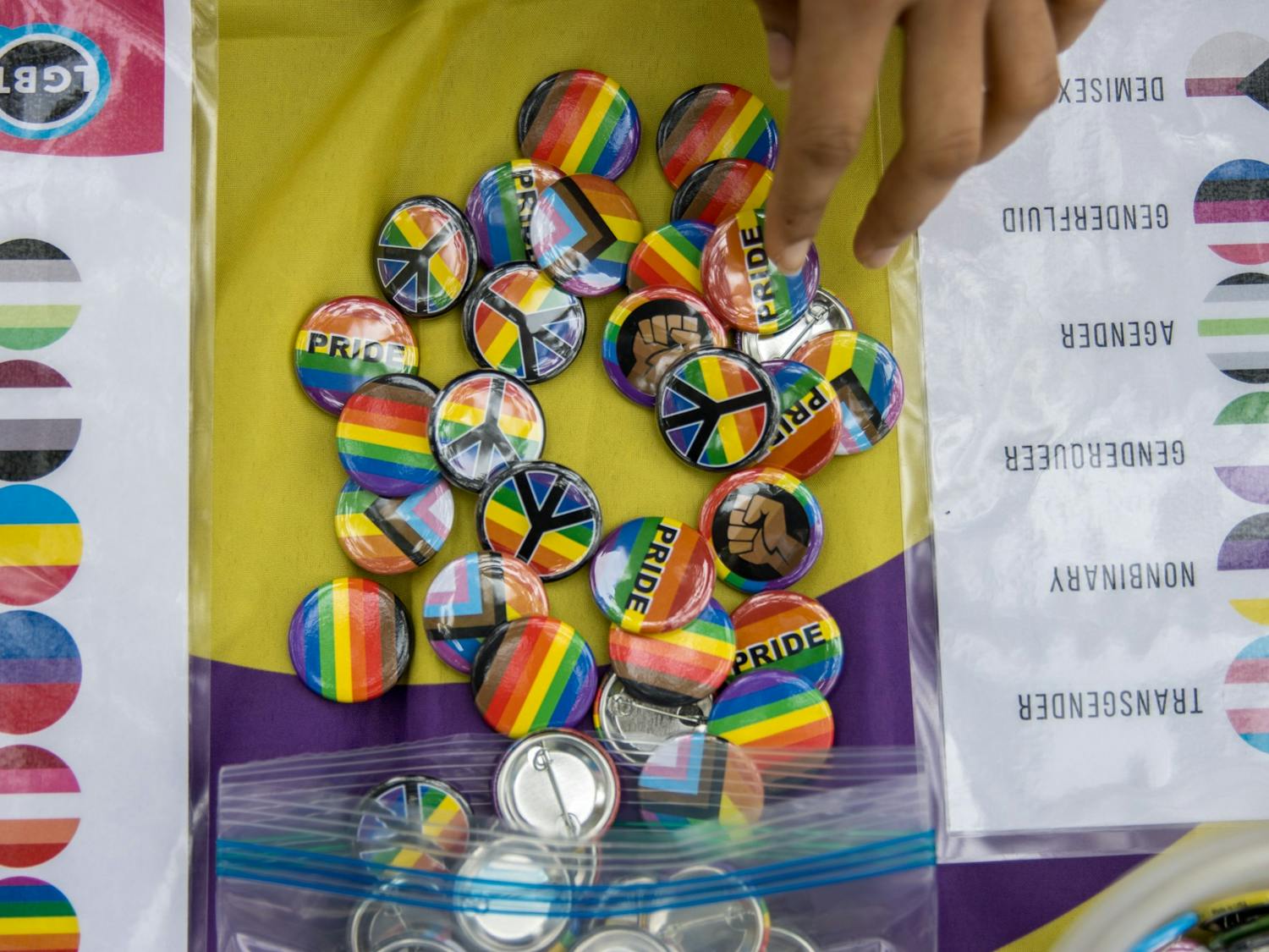 Various pride pins were offered to patrons who visited the coming out day table in the Pit on Oct. 11. The event was sponsored by UNC's LGBTQ Center.&nbsp;