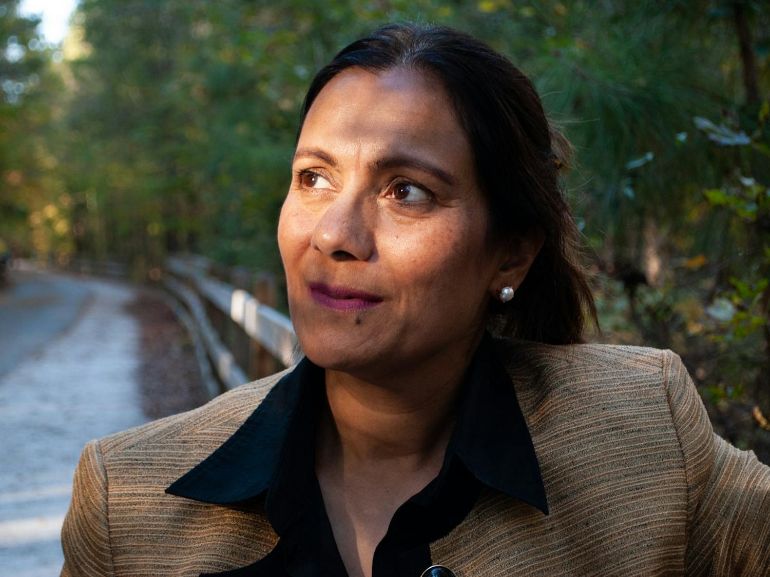 Seema Kak, the executive director of Kiran, poses for a portrait on Nov. 9. Kiran's mission is to empower and support South Asian victims of domestic violence in North Carolina.