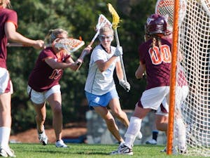 Senior attacker Kristen Taylor slices her way through the Virginia Tech defense looking to score a goal. DTH/Phong Dinh