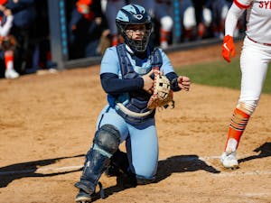 UNC junior catcher Taylor Greene (15) talks to the dugout in Anderson Softball Stadium in Chapel Hill, NC on Feb. 20, 2021. The Syracuse Orange beat the Tar Heels 3-2.
