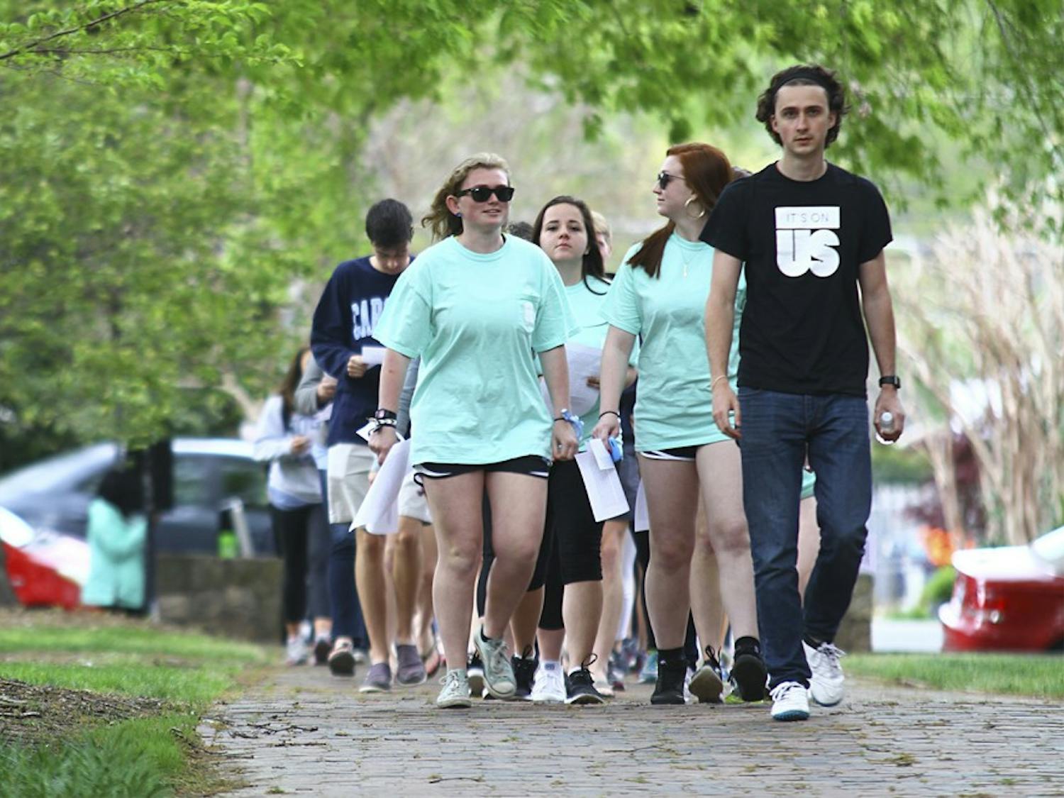 UNC students participate in a walk as a part of the “It’s On Us” even, which sought to raise awareness of and prevent sexual assault.