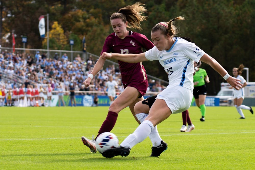 UNC junior midfielder Avery Patterson (15) passes the ball during the women's soccer ACC Finals against FSU at WakeMed Soccer Park on Sunday, Nov. 6, 2022.