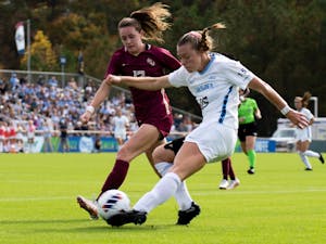 UNC junior midfielder Avery Patterson (15) passes the ball during the women's soccer ACC Finals against FSU at WakeMed Soccer Park on Sunday, Nov. 6, 2022.