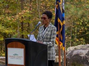 Renee Price of the Orange County Board of Commissioners introduces guest speaker Sheriff Charles Blackwood at the Orange County Veterans Day Program on Nov 11.