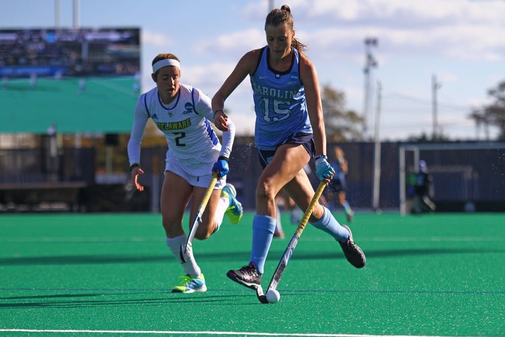 <p>North Carolina field hockey's Malin Evert advances the ball against Delaware in the 2016 NCAA title game.</p>