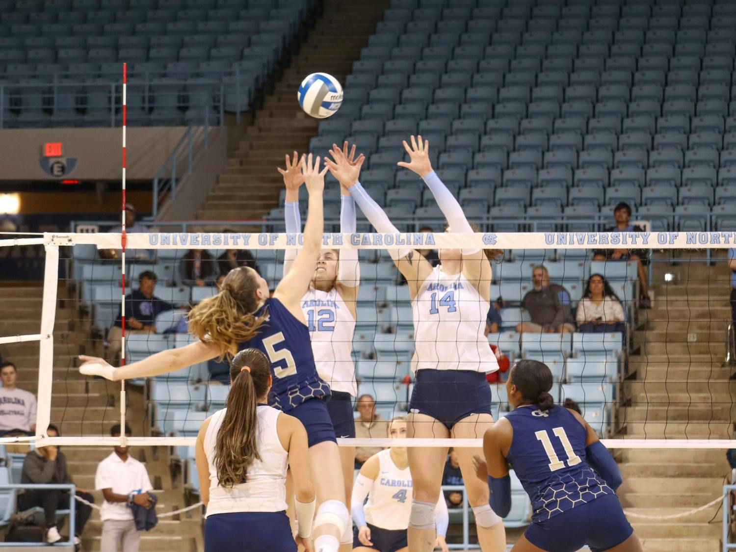 UNC freshman setter Anita Babic (12) and junior middle hitter Kaya Merkler (14) block the ball during the volleyball match against Georgia Tech on Friday, Oct. 28, 2022 at Carmichael Arena. UNC lost 3-1.
