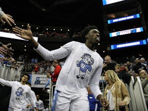First-year guard Nassir Little (5) high-fives fans as he runs to the court before the game against Washington in the second round of the NCAA tournament at Nationwide Arena in Columbus, OH on Sunday, March 24, 2019. UNC defeated Washington 81-59. Little scored 20 points for the Tar Heels. 