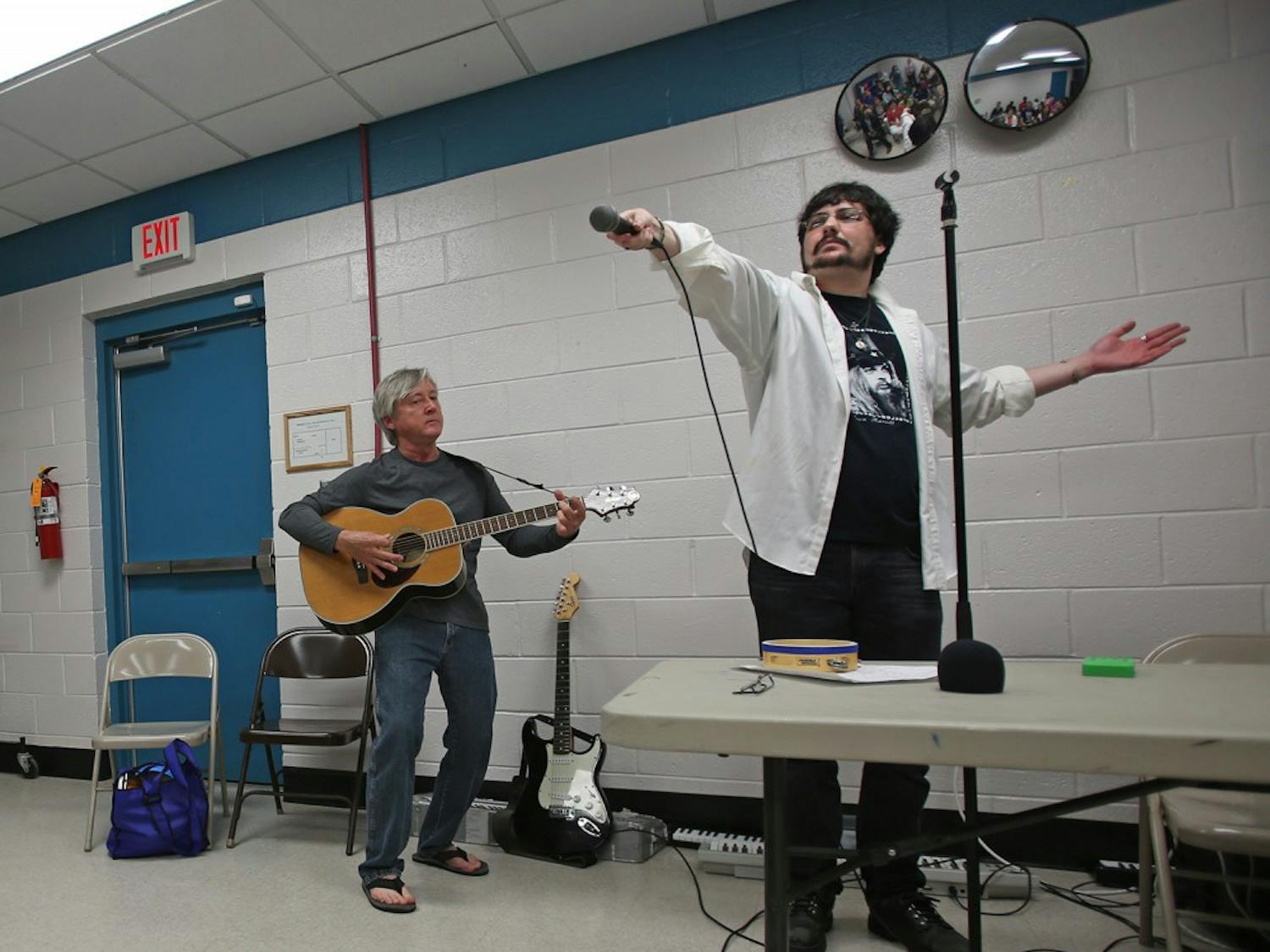 (CROP OUT THE TWO PEOPLE ON THE LEFT) Steve Schlosser (left), 58, and Alex Feltch, 25, who comprise the band Sonic Impact, perform at Push Play Sing, an event that provides musical engagement for people in the community with developmental disabilities. The event took place at the Chapel Hill Community Center on Friday, April 14. 