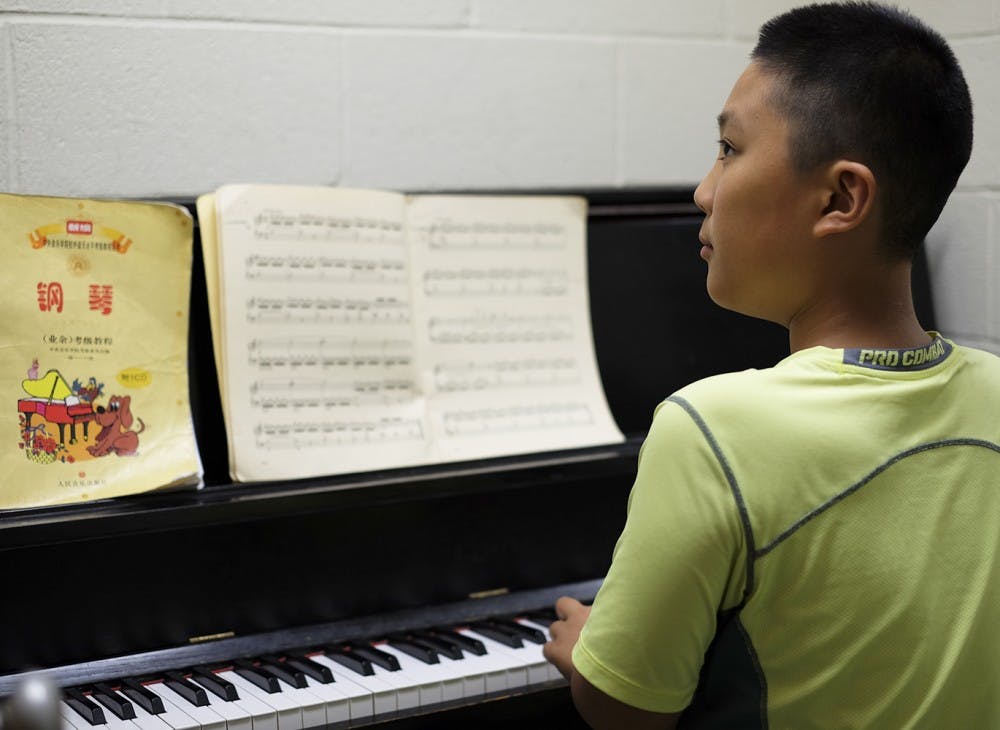 Haotian Pan practices in one of Hill Hall’s small practice rooms on Tuesday. Pan practices there often.