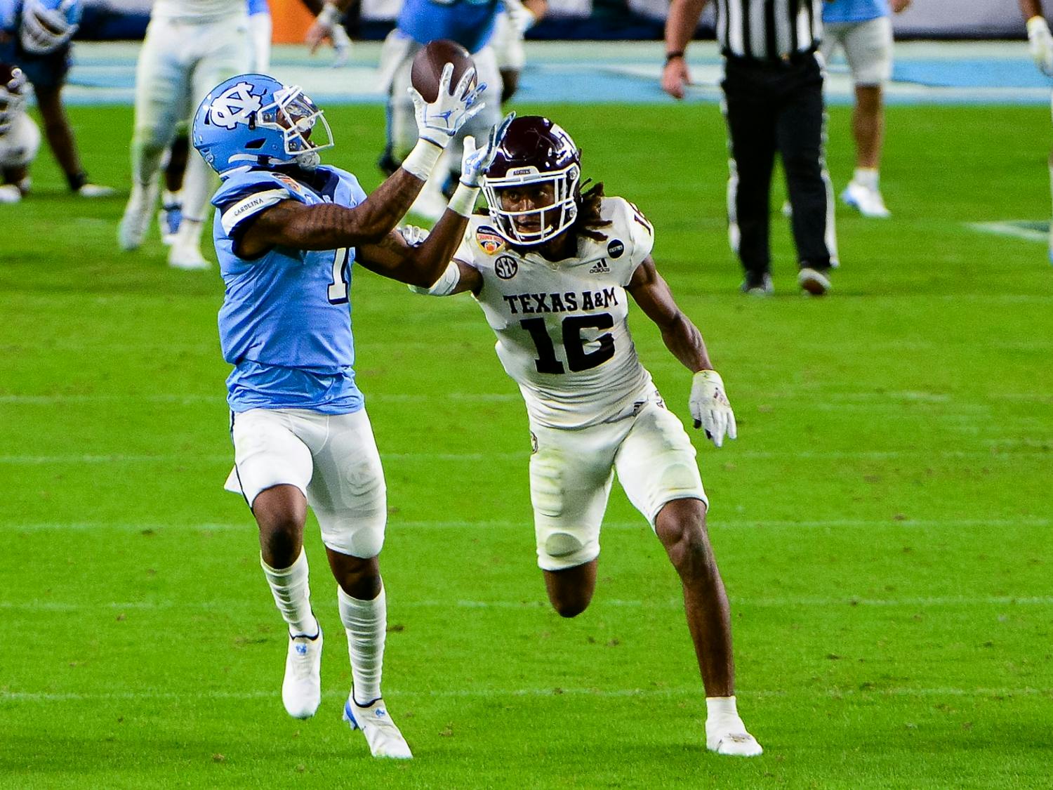 UNC's redshirt first year wide receiver Khafre Brown (1) attempts a catch during the Capital One Orange Bowl against Texas A&M in Hard Rock Stadium on Saturday, Jan. 2, 2021. Texas A&M beat UNC 41-27.