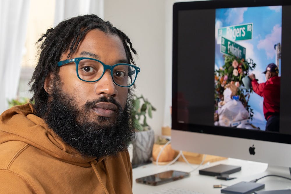 <p>Cornell Watson, the photographer behind "Tarred Healing," poses for a portrait in his Durham office on Saturday, Feb. 26, 2022. "Tarred Healing" is a photo story reflecting on Black history in Chapel Hill and at UNC.&nbsp;</p>