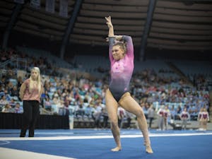 Megan Ruzicka performs her floor routine during home opener and annual Women's Day and Pink Meet against Oklahoma and Ball State on Saturday, Jan. 19, 2019. UNC placed second behind Oklahoma.