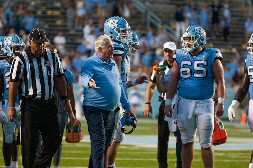 Mack Brown speaks with referees in Kenen Stadium on Sept. 24, 2022, at the UNC game against Notre Dame. UNC lost 45-32.
