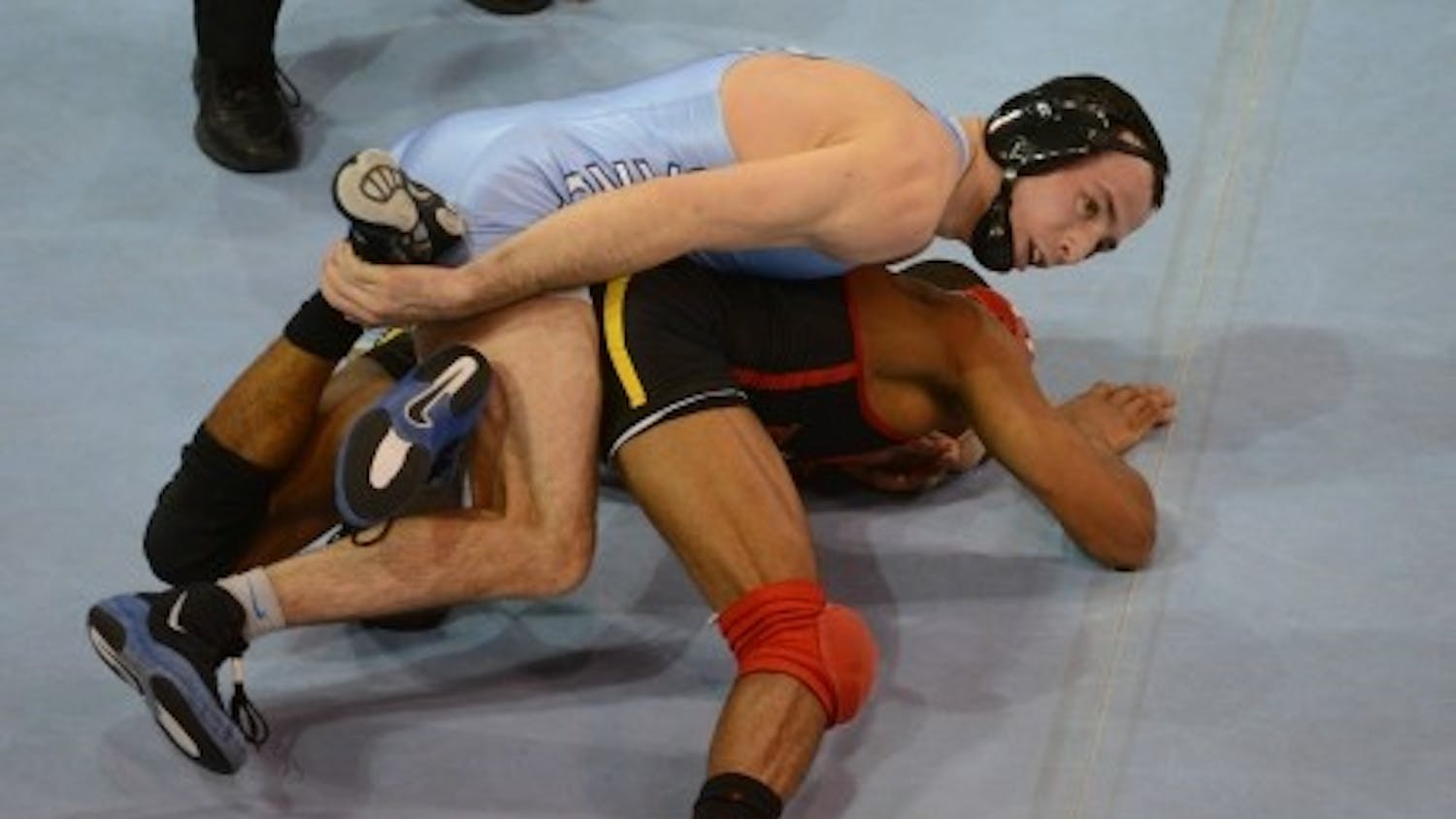 UNC’s Evan Henderson wrestles Maryland’s Shyheim Brown in January of 2014.&nbsp;Henderson won 4-0.