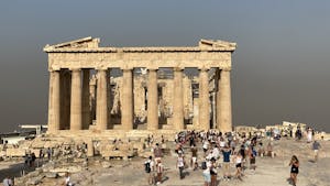 A cloud of smoke from nearby wildfires surrounds the Parthenon in Athens, Greece on Aug. 4.