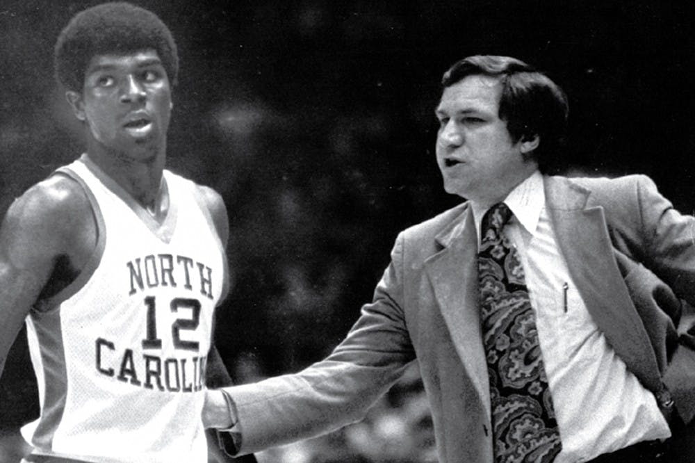 	<p>North Carolina coach Dean Smith talks to point guard Phil Ford in 1977. Ford led the Tar Heels to the national title game but scored only six points in the championship match for <span class="caps">UNC</span>.</p>
