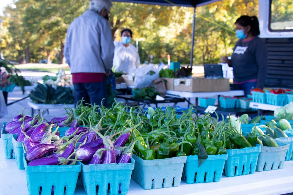 Local eggplants and peppers are sold at the Chapel Hill Farmers Market on Oct. 26. The Got To Be NC Pavilion allows local farms to show, sample and sell their products at the N.C. State Fair. 