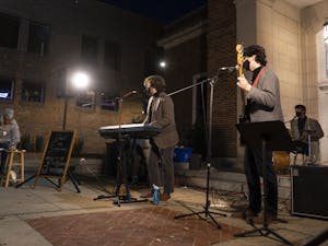 Local band "Jack the Songman" plays outside of the Chapel Hill Courthouse on Saturday, Nov. 7, 2020. with social distance and mask policies in place for COVID-19 safety.