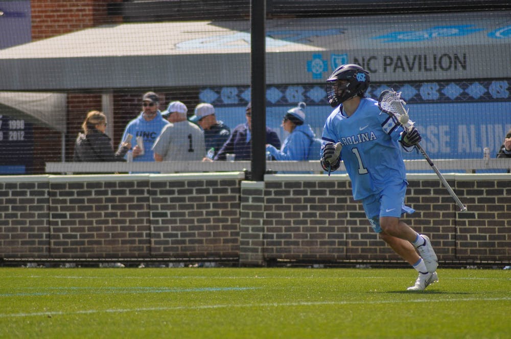 Graduate attackman Logan McGovern (1) cradles the ball during the men's lacrosse game against Brown at Dorrance Field on Saturday, March 11, 2023. UNC won 19-6.