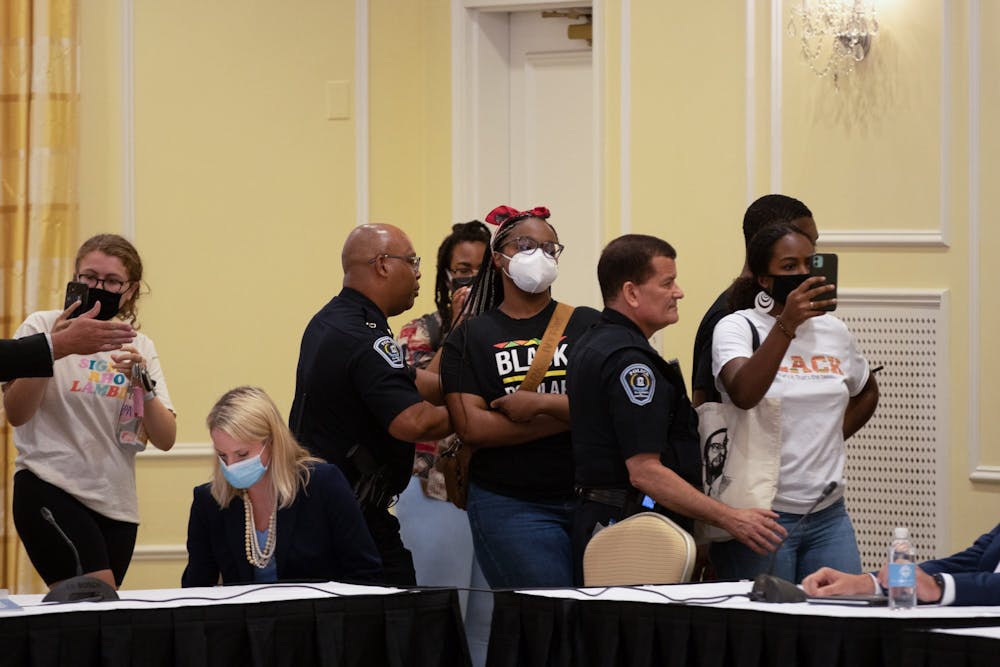 <p>Demonstrators gather at the Board of Trustees' special meeting on June 30 as the Board goes into closed session to deliberate on Nikole Hannah-Jones' tenure case.</p>